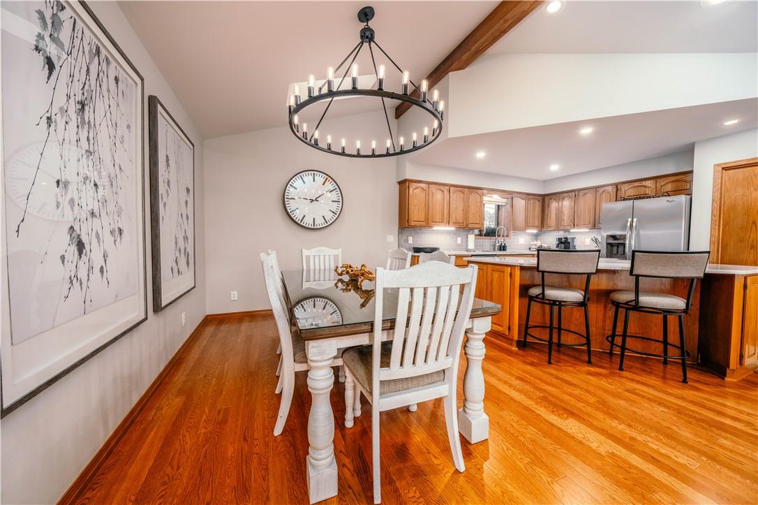 Image 4: Open-concept kitchen and dining area.