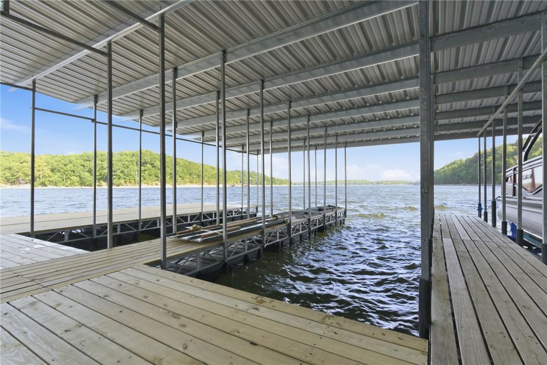 Image 3: Covered boat dock featuring two slips, corrugated