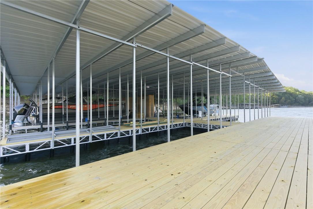 Image 4: Dock structure with multiple boat slips, featuring