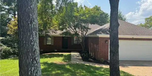 Image 2: Brick exterior with an attached two-car garage, co