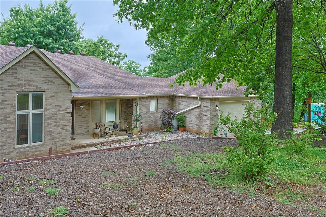 Image 3: Brick exterior residence featuring a front porch,