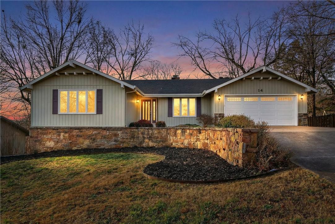 Image 4: Ranch-style house with a garage, driveway, a chimn