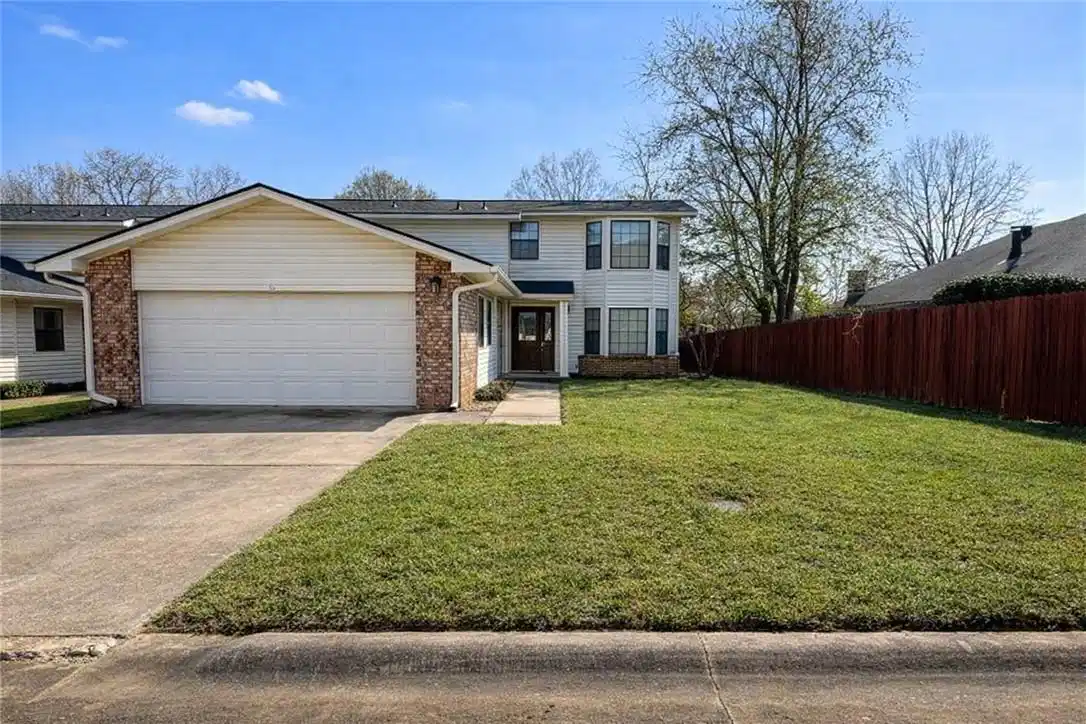 Image 1: Traditional home featuring an attached garage, con