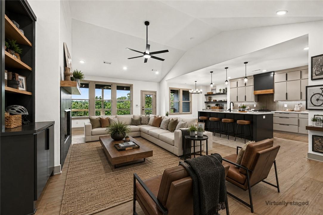 Image 2: Vaulted ceilings, wood-finish flooring, built-in s