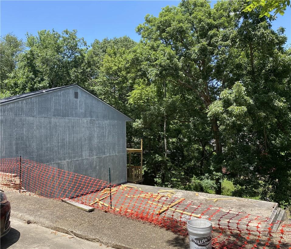 Image 2: View of existing unit next door and existing slab