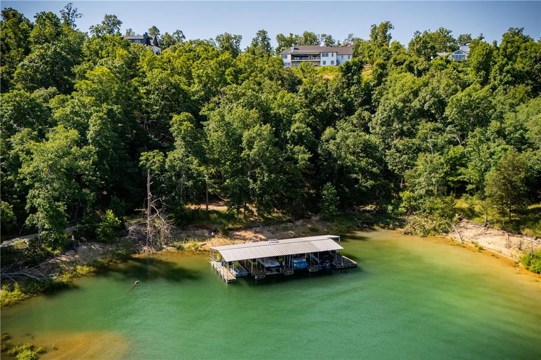 Image 4: Private boat dock featuring a metal roof and multi