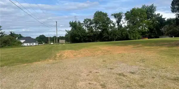 Image 3: Expansive grounds featuring a level, open lawn wit