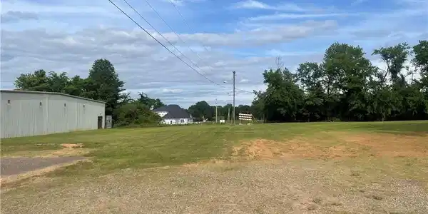 Image 4: Spacious cleared lot with mature trees and establi