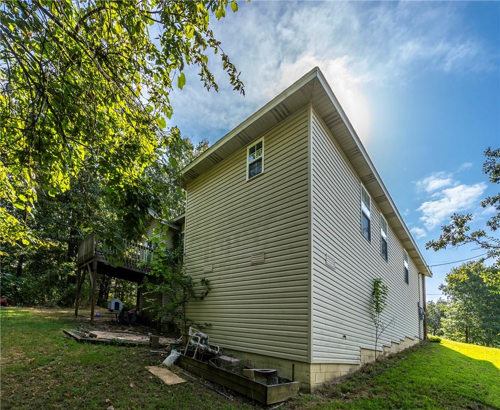 Image 3: Exterior featuring horizontal vinyl siding, multip