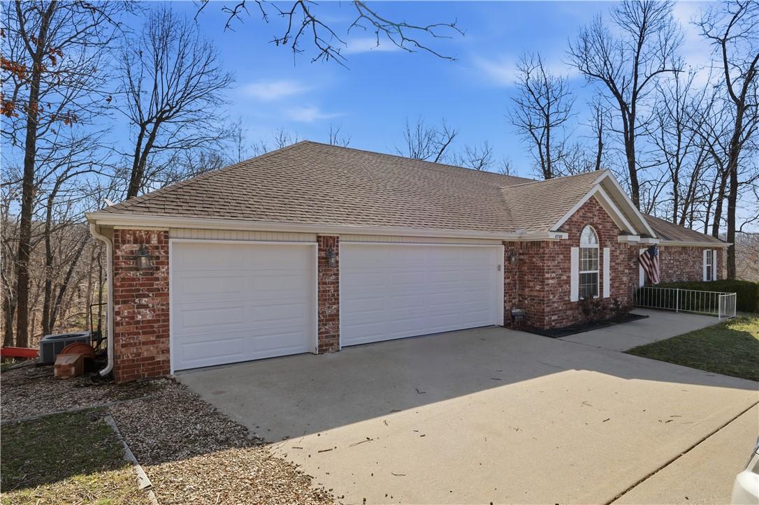 Image 1: View of front of home featuring a 3 car garage and
