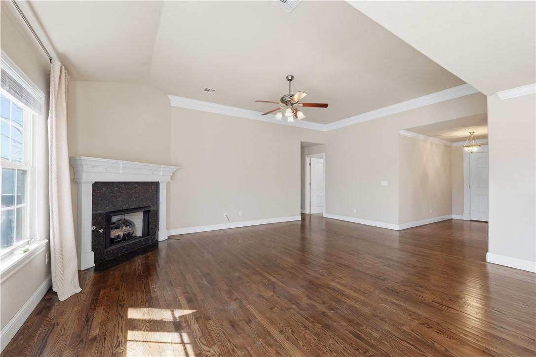 Image 4: living room featuring a gas fireplace, ceiling fan