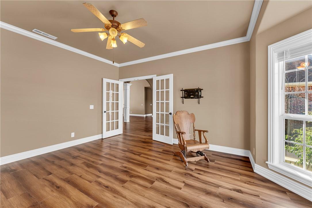Image 3: Living area with french doors, ornamental molding,