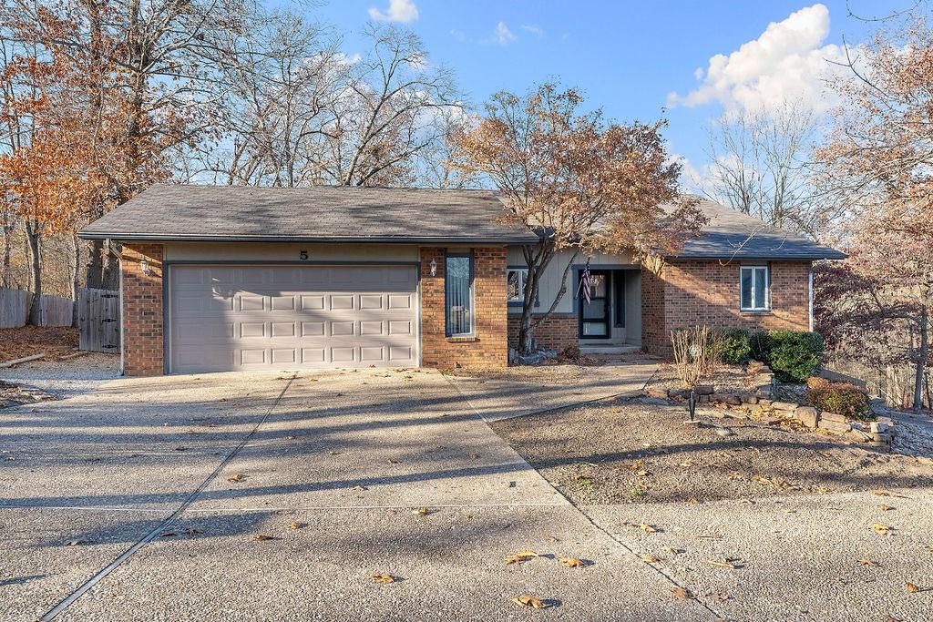 Image 4: Ranch-style house with concrete driveway, a shingl