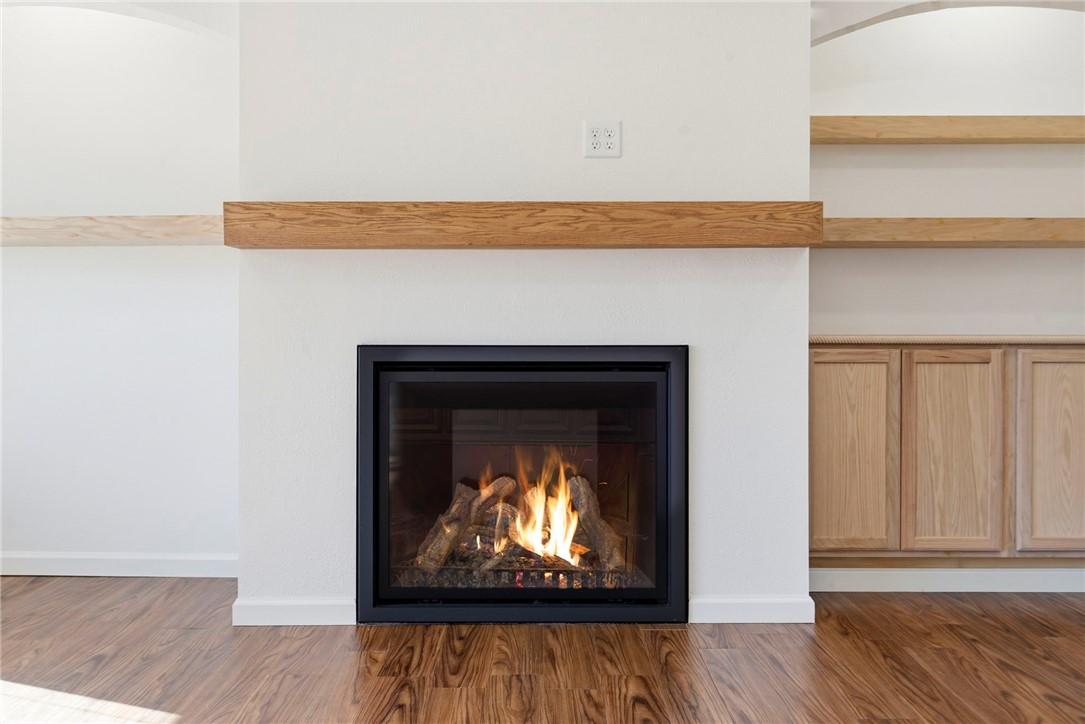 Image 3: Detailed view of wood finished floors and a warm l