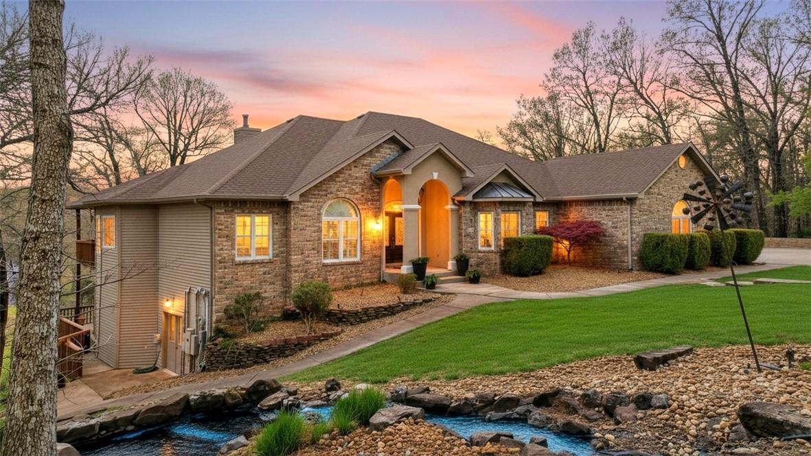 Image 4: View of front facade with a front lawn, roof with