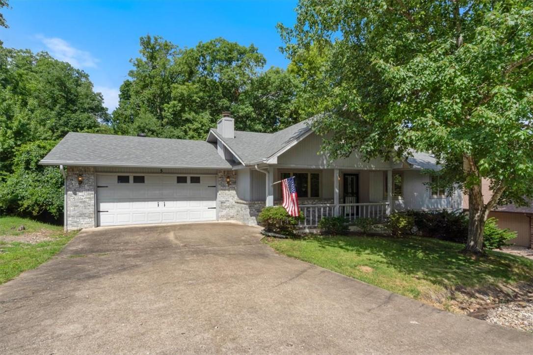 Image 1: Ranch-style residence featuring a two-car garage,