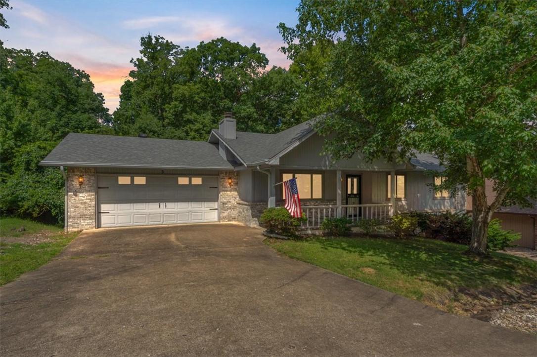 Image 2: Stone veneer accents highlight the property's exte