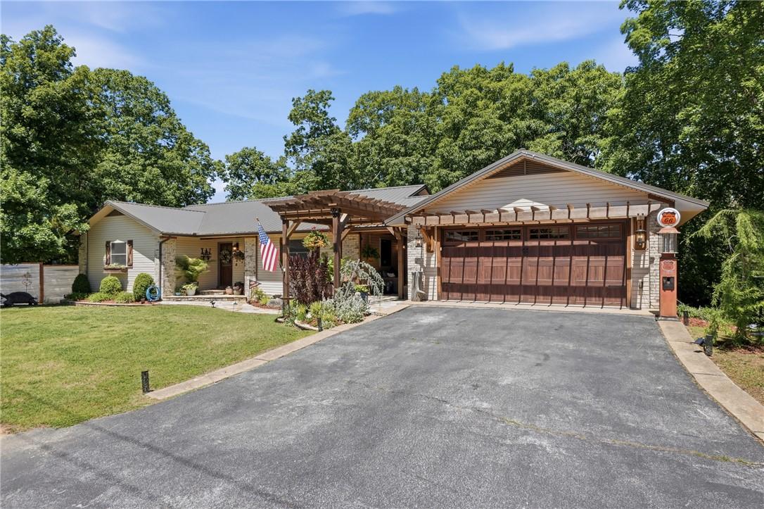 Image 3: Residence featuring a stone and siding exterior