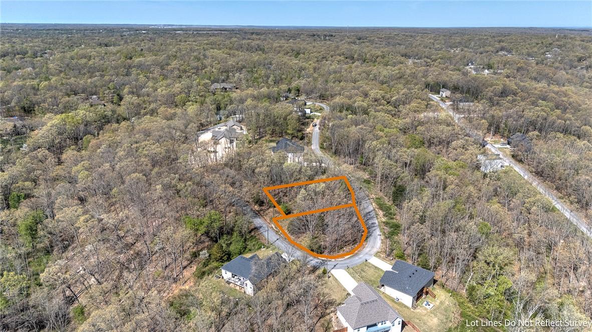 Image 4: View of property location with a heavily wooded ar