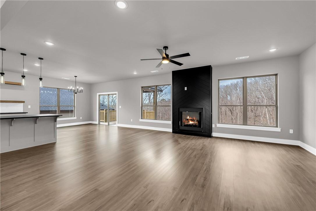 Image 2: Wide open living area and focal point fireplace