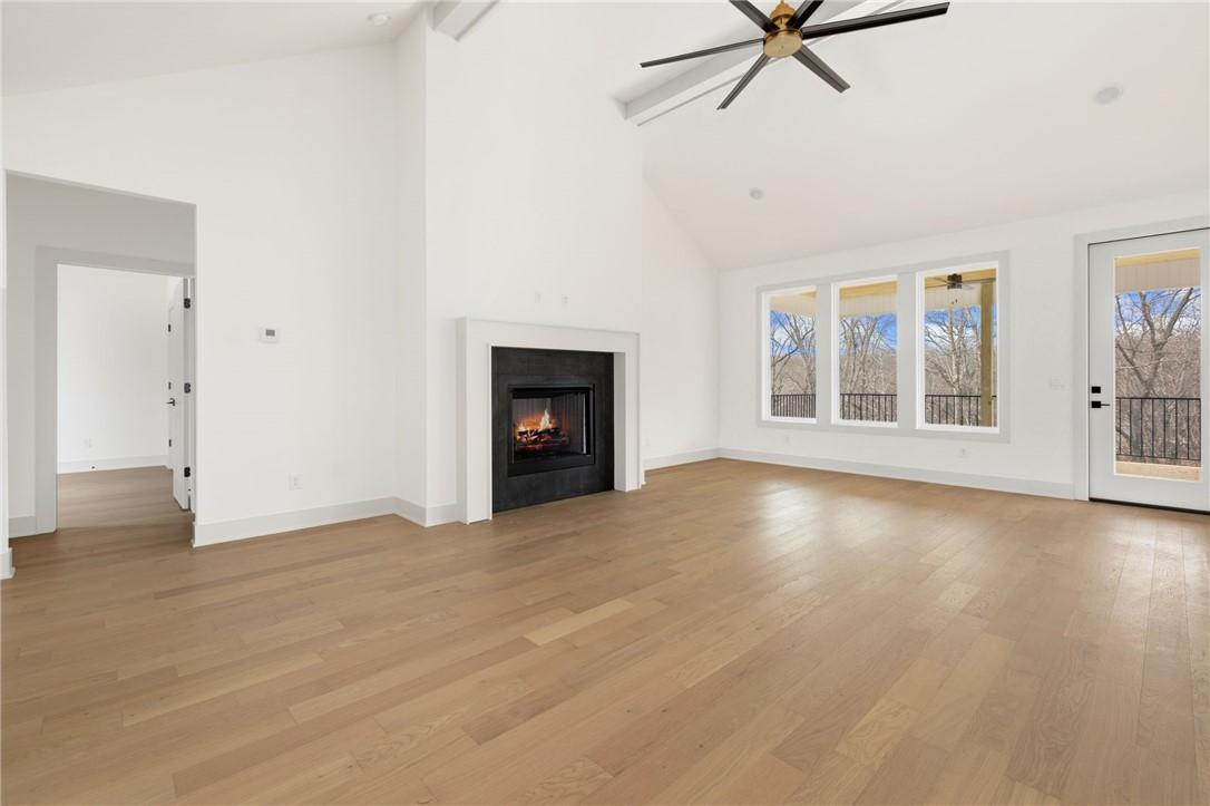 Image 3: Unfurnished living room with plenty of natural lig