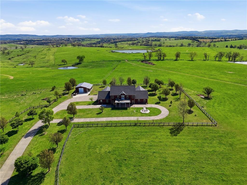 Image 1: View of rural area featuring agricultural land and