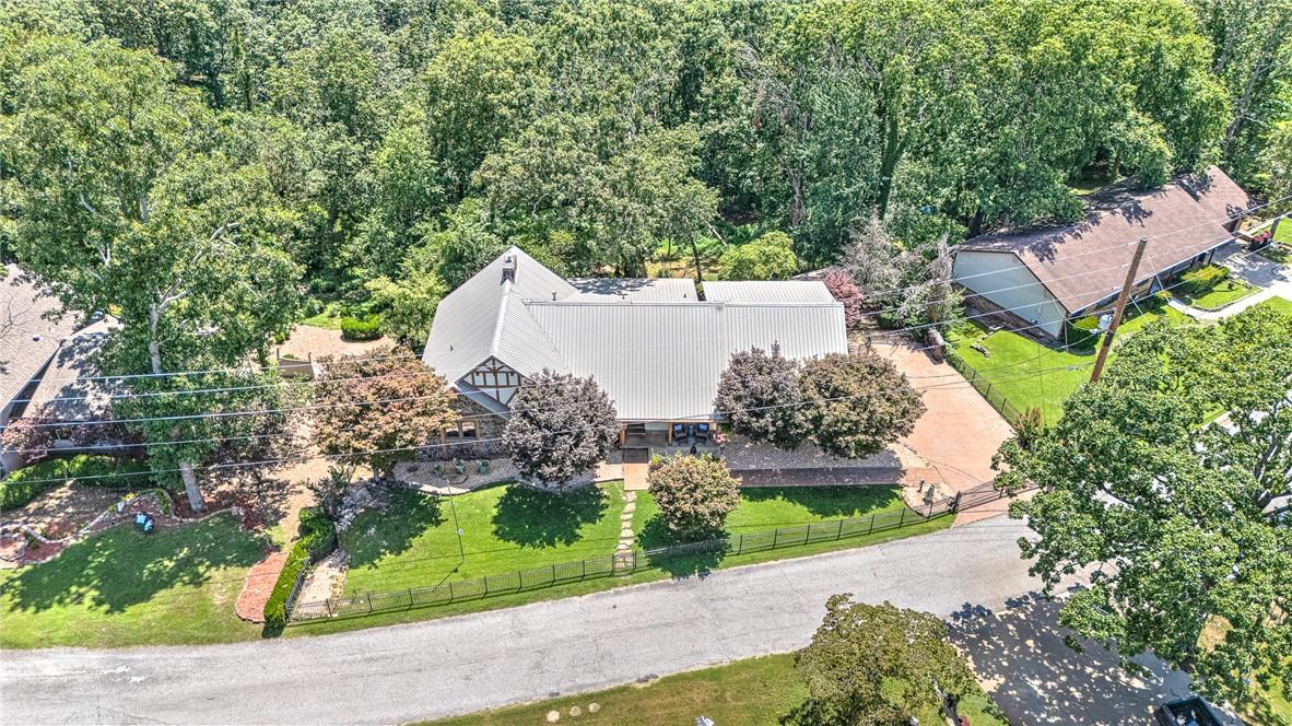 Image 2: Aerial perspective showcasing a property surrounde
