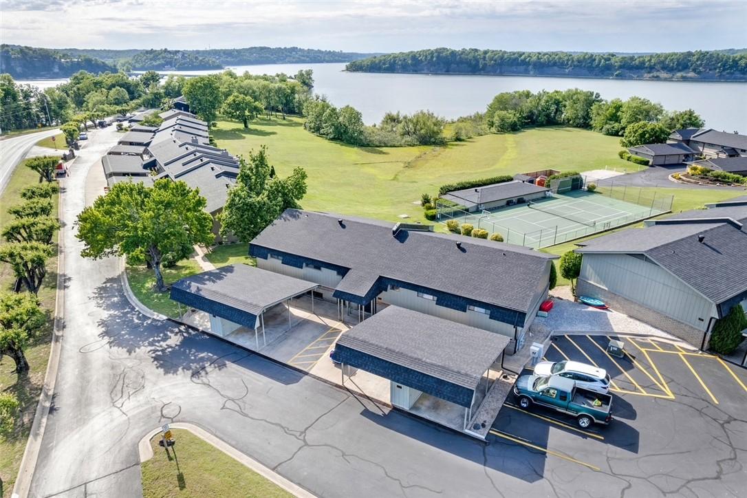 Image 1: Waterfront property featuring multiple residences,