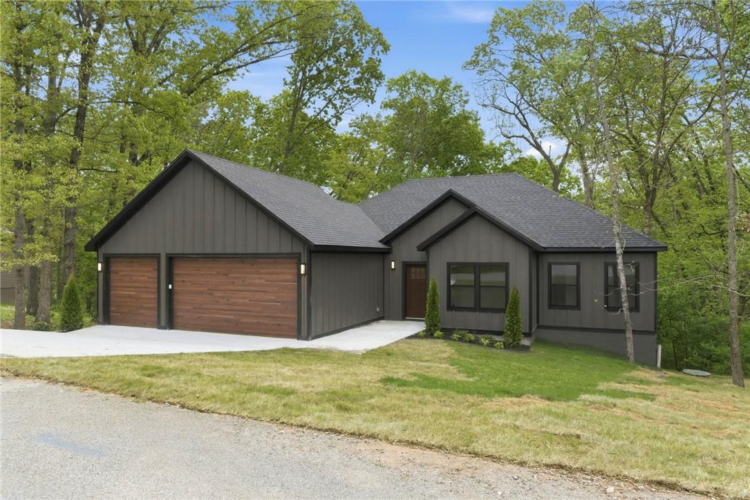 Image 3: Contemporary dark gray exterior featuring vertical