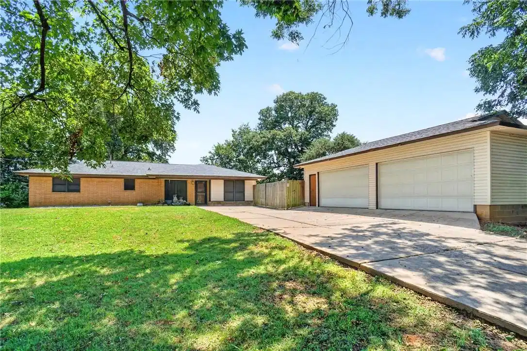 Image 1: Brick mid-century modern residence showcasing a sp