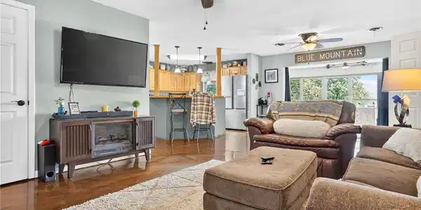 Image 3: Spacious living room featuring hardwood flooring,