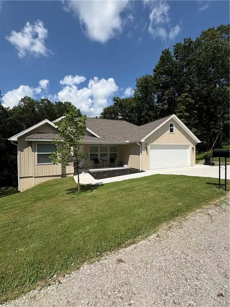 Image 1: Single-story residence featuring light-colored sid