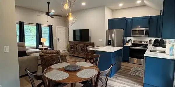 Image 4: Open-concept living space featuring wood-finish fl
