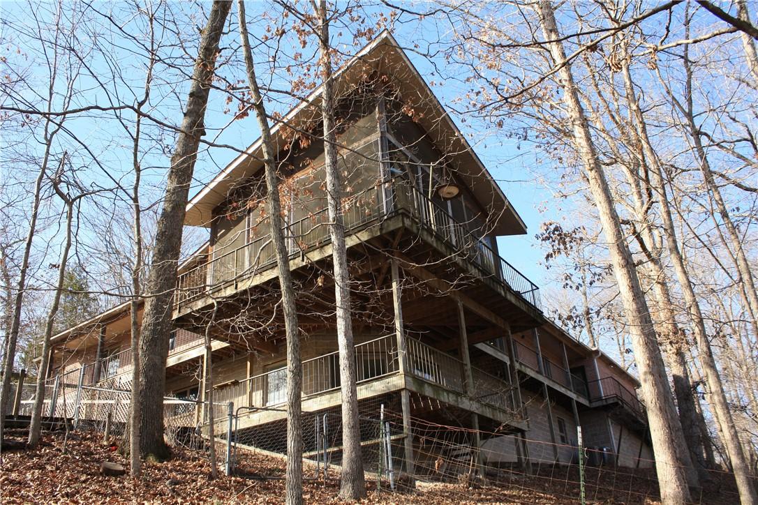 Image 1: View of side of property with a deck