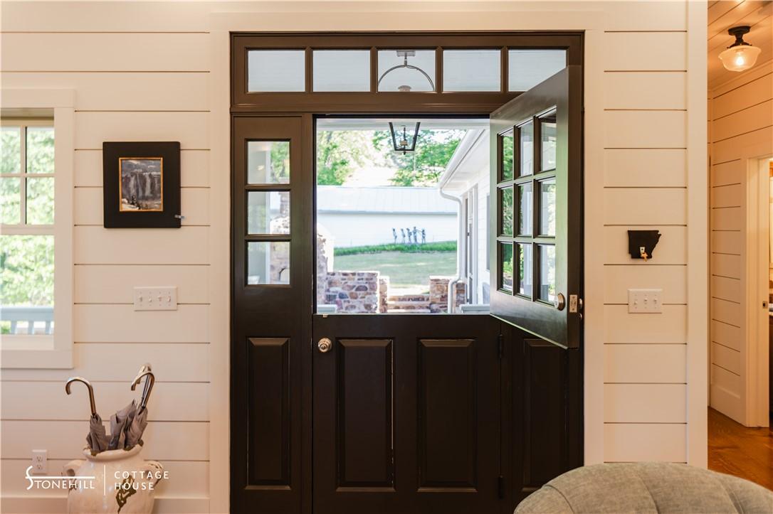 Image 4: The entry is marked by a Dutch door that is as cha