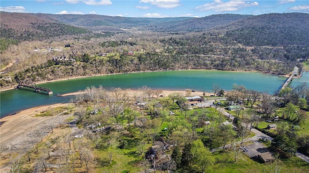 Image 1: Expansive aerial showcasing a body of water with s