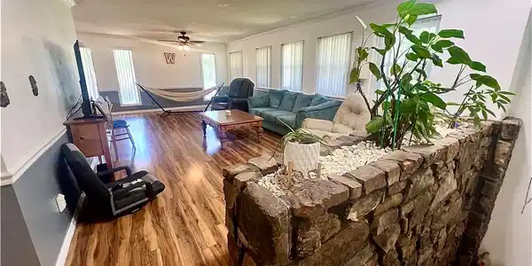 Image 4: Spacious interior featuring a stone planter with i