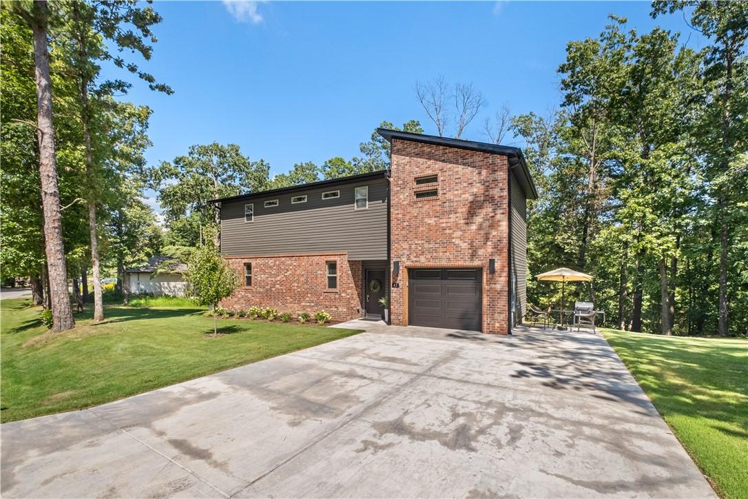 Image 2: Contemporary exterior featuring brick and horizont