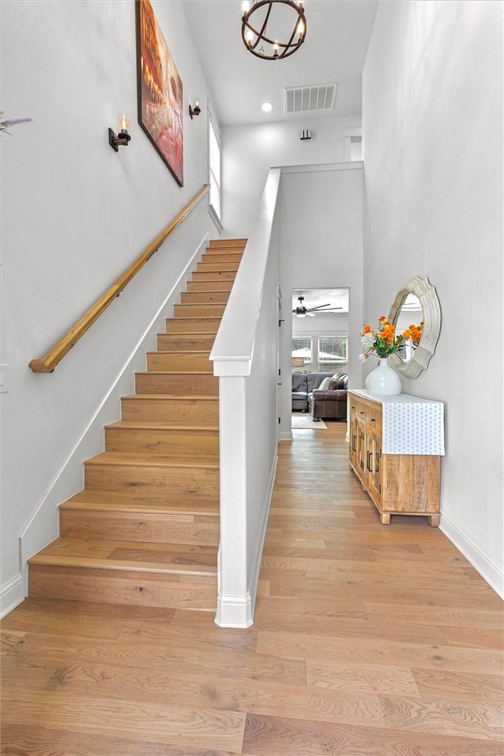 Image 3: Entryway featuring wood-finish flooring extending