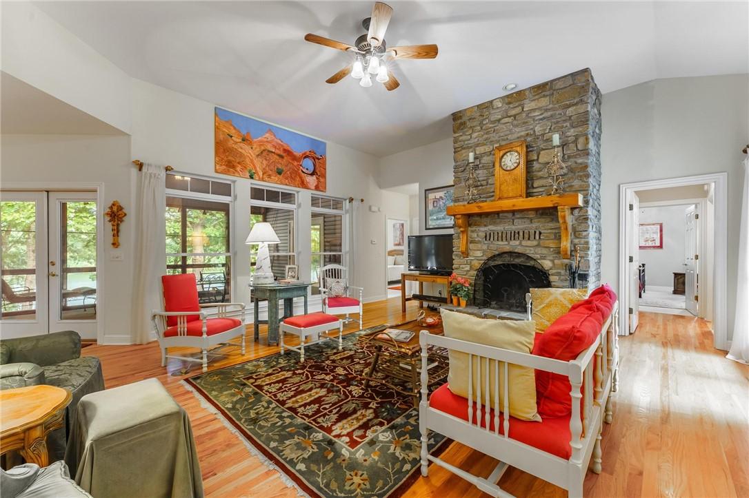Image 4: The stone fireplace is one of a kind and really ma