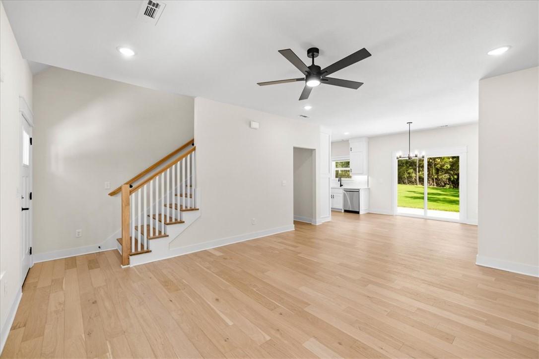 Image 2: Bright and inviting open-concept design with moder
