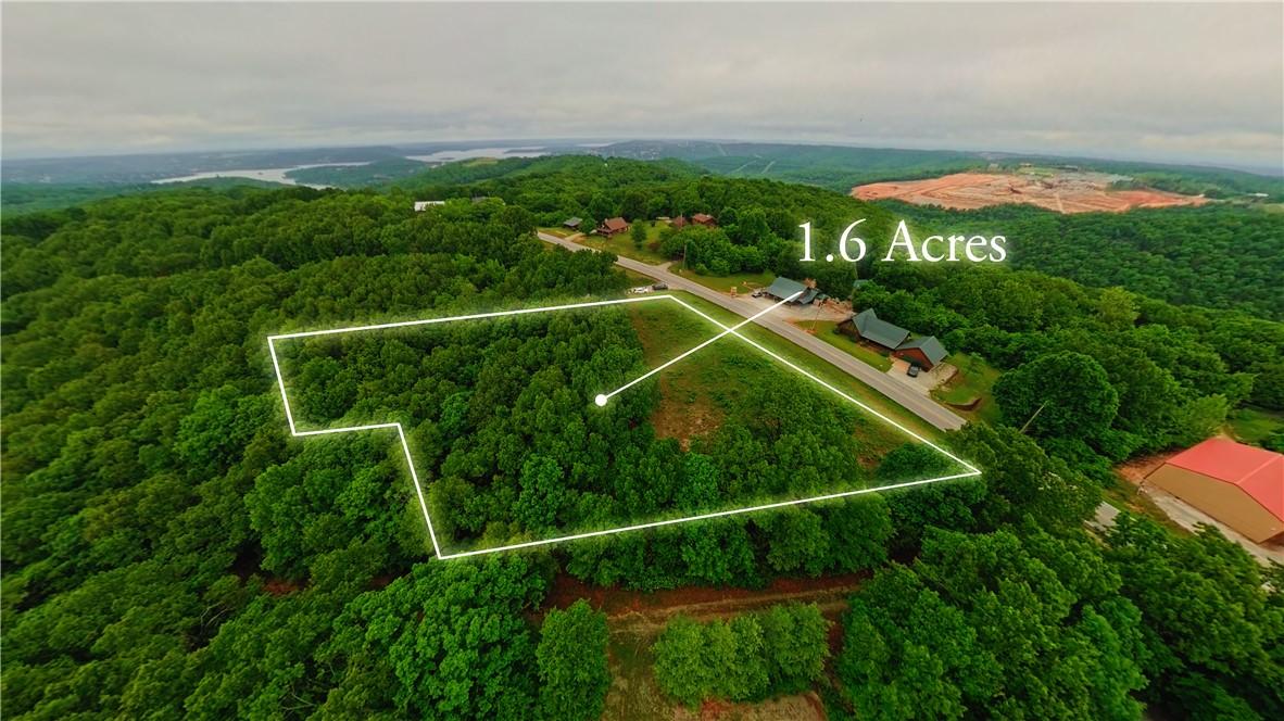 Image 1: 1.6-acre parcel featuring mature tree coverage