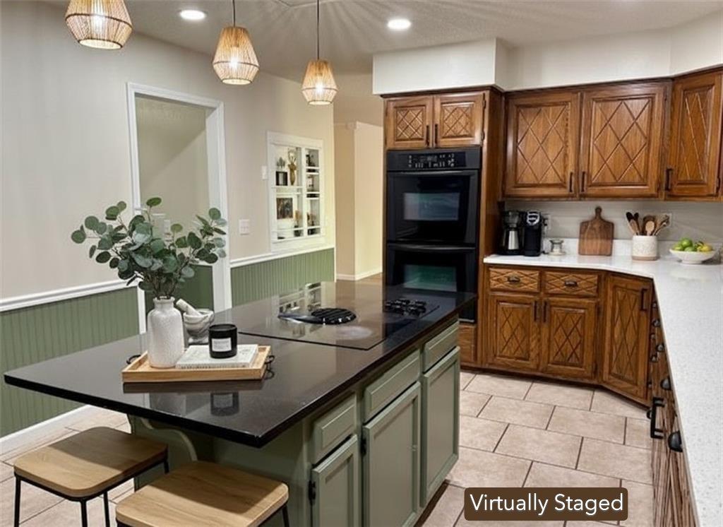 Image 4: Virtually Staged. It comes with  double ovens and