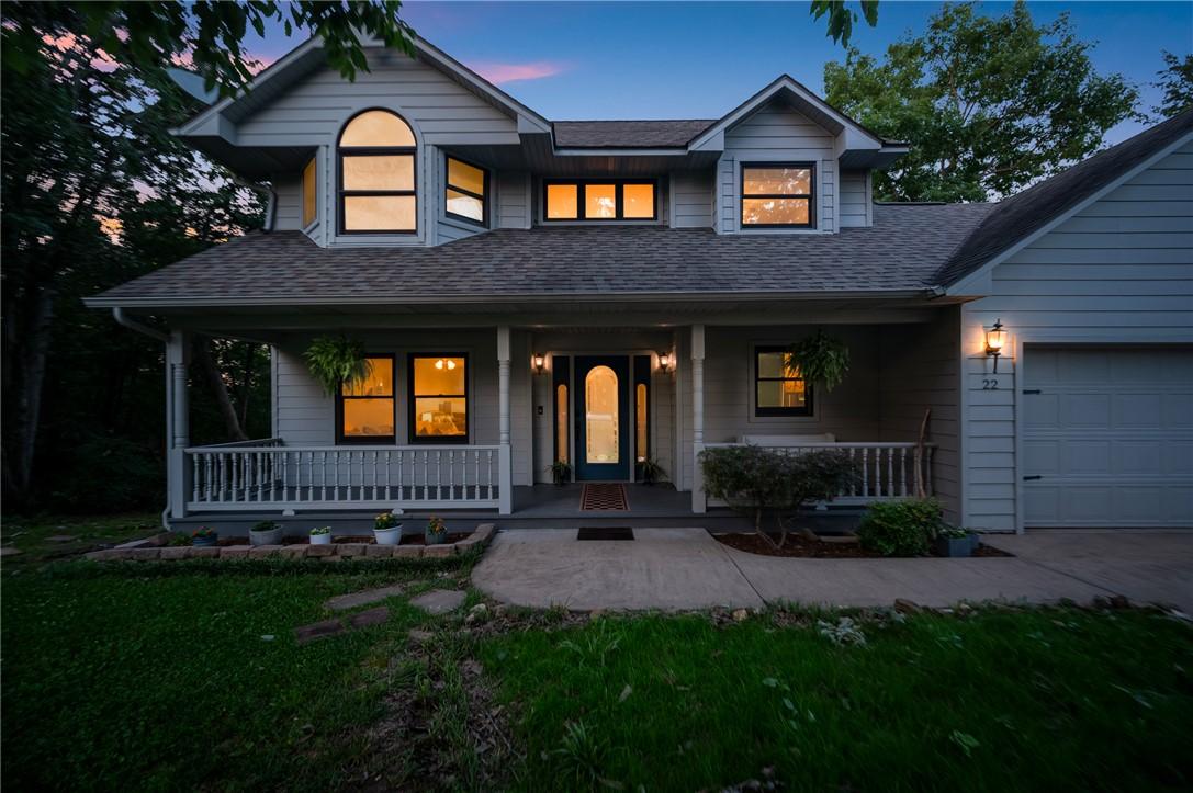 Image 2: Two-story residence featuring light-colored siding
