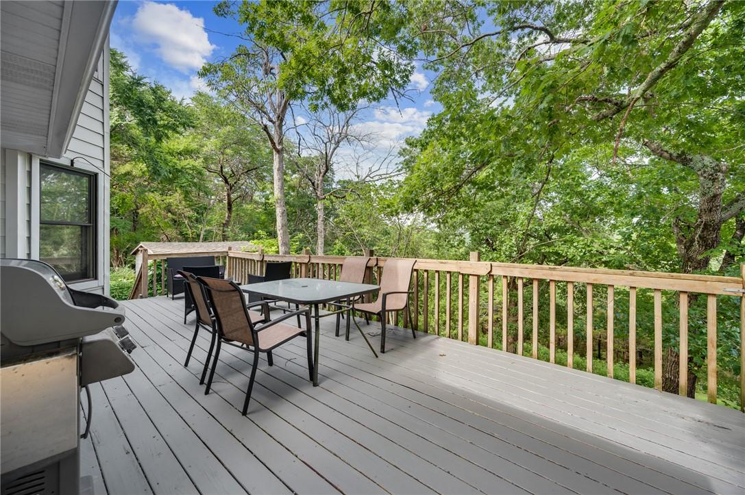 Image 4: Expansive outdoor deck featuring wood flooring and