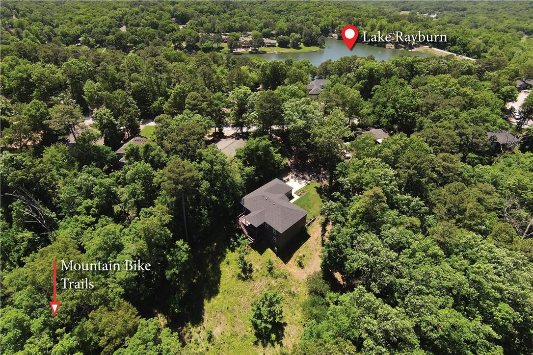 Image 2: Aerial perspective showcasing a property surrounde