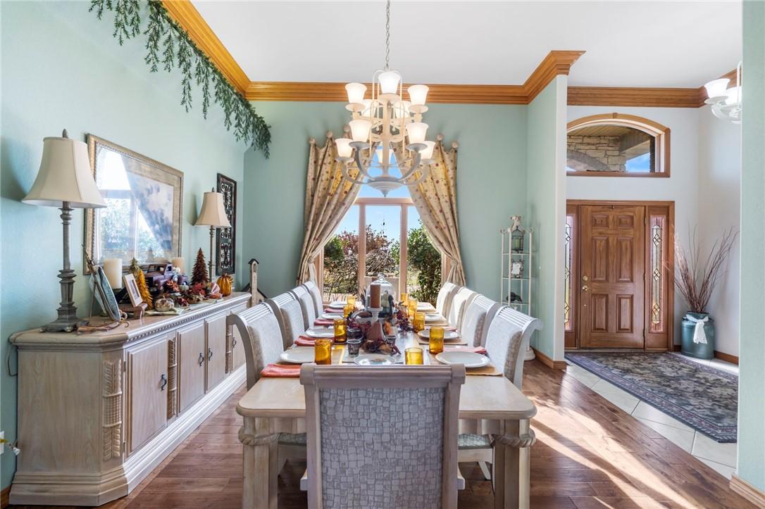 Image 4: Dining area featuring a chandelier, hardwood / woo