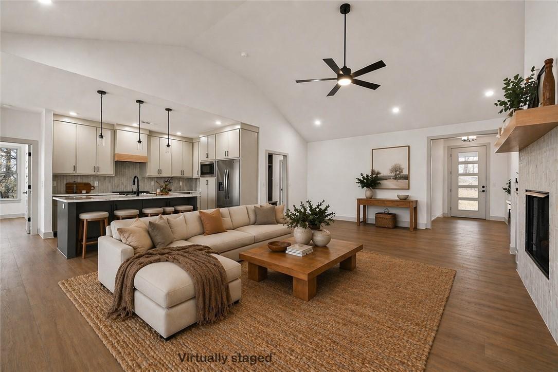 Image 3: Open-concept living space featuring a vaulted ceil