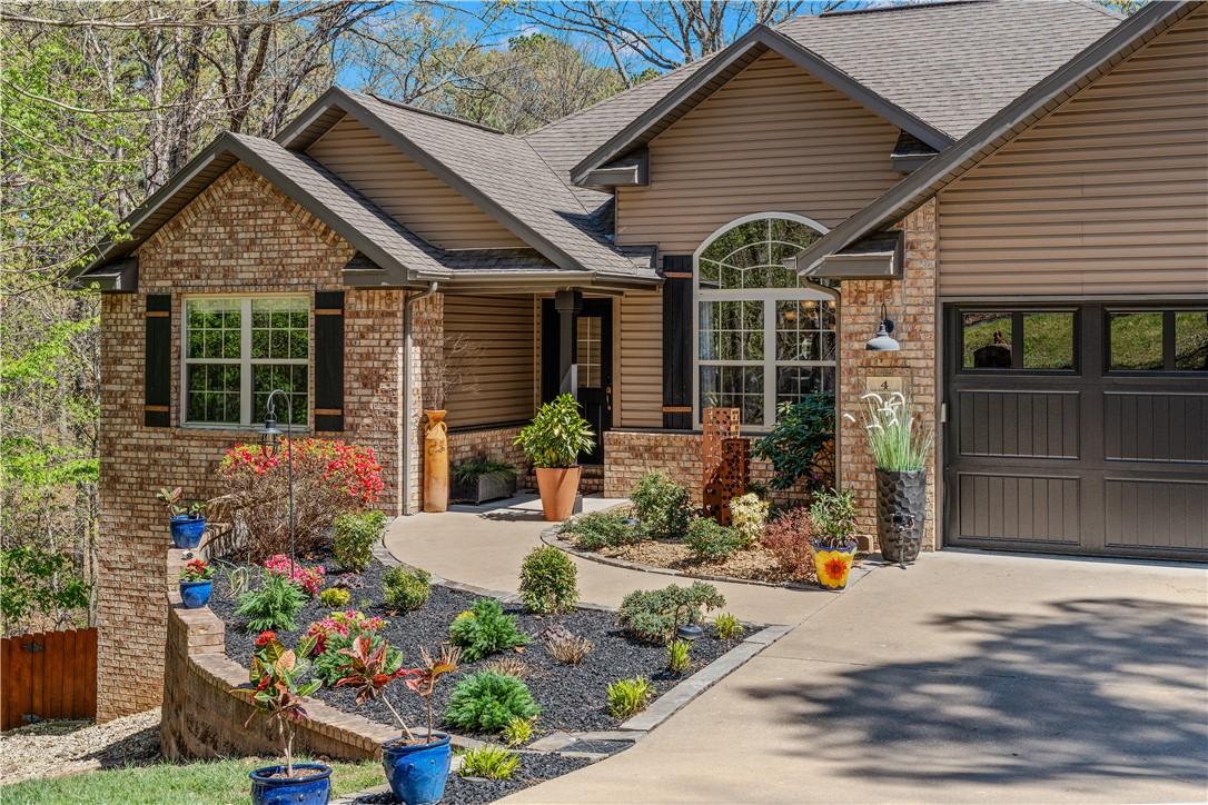 Image 4: View of front of house featuring brick siding, a p