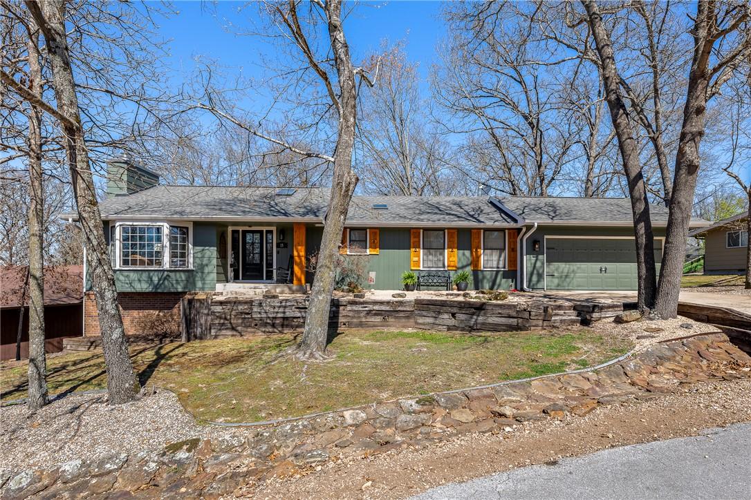 Image 1: Ranch-style home with updated cedar accents